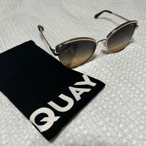 Quay sunglasses with little crystal-like details on top of sunnies.